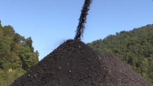 Coal falls into a pile outside of mine near Hazard, KY